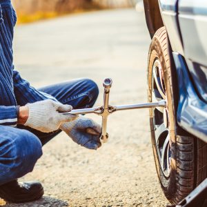 Change a flat car tire on road with Tire maintenance, damaged car tyre